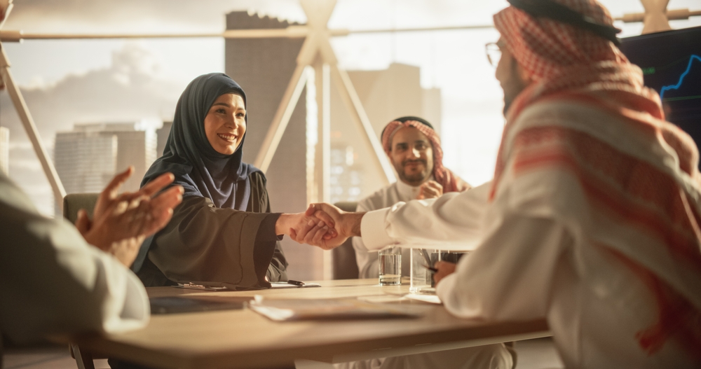 Muslim,Businesspeople,Closing,A,Business,Deal,At,A,Corporate,Modern